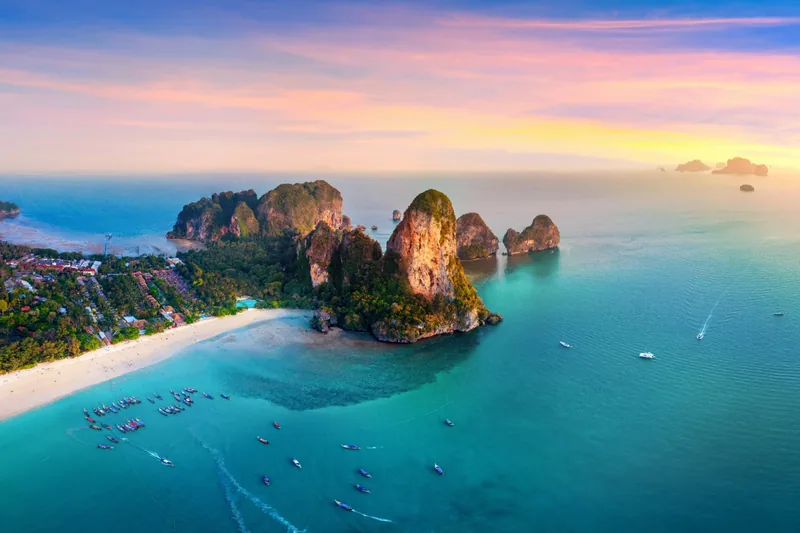 Aerial view of Railay beach and its limestone headlands at sunset, Krabi